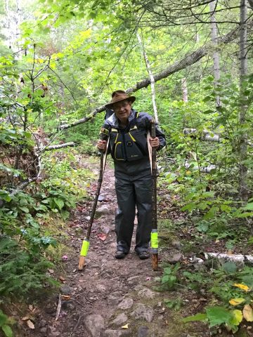 Photos: Bill Foltz using hand-crafted crutches. Photo Credit: Veronica Johnson