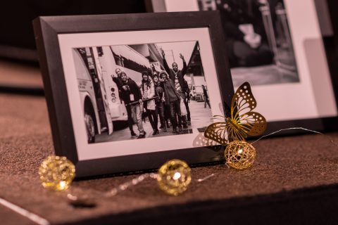 Photos from GYC history lined the stage at the convention in 2022.  [Photo: Samuel Girven]