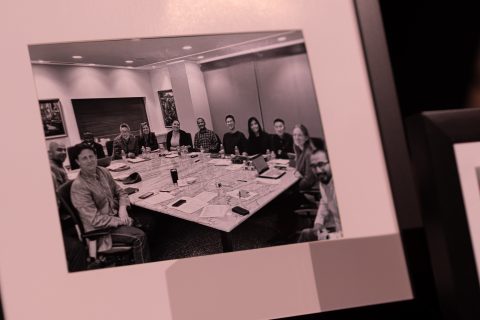 Photos from GYC history lined the stage at the convention in 2022. Pictured here is GYC's board of directors at a meeting. [Photo: Samuel Girven]