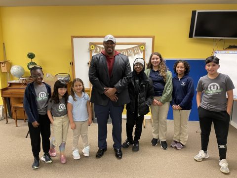 Mayor Ron Bacon (middle) standing with UChurch young scholars (left to right) Keola Majee, Olivia Im, Isabella Ferreira, Philip Owusu, Gabriella Ferreira, Madeline Huddleston, and Titus Ramos.
