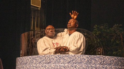 After the megaclinic Pathway to Health, Indianapolis Pastor Tunde Ojewole baptized Johnson Odunuga. [Photo credit: Marcos Paseggi]
