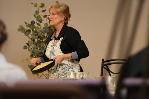 Patricia LaVenture shows her Focaccia bread in a cast iron pan  
