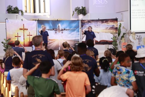 Kimberly Spare and Sue Mondak lead out in the VBS program at Village SDA Church. [Robert Rice]
