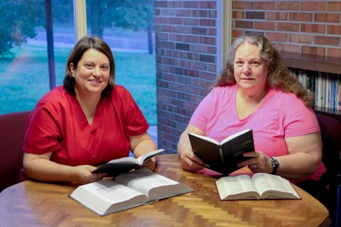 Kelli Hopper (left) studies the Bible each week with Corky Benny.  Photography by Marjie Shade