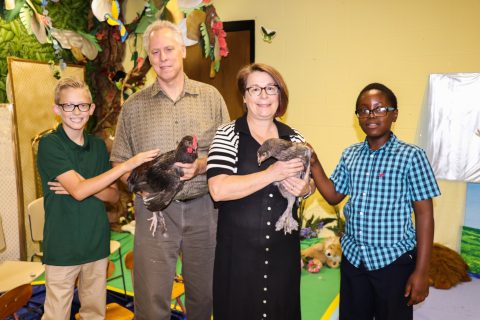 Chickens were brought into the Sabbath school classroom to help the children make the connection with their fundraising efforts to buy chickens in Kenya. Courtesy Khai Khai Cin