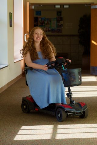 My disability, muscular dystrophy, affects my mobility though I can walk some distances. I always knew I would be able to go to college but would need a mobility aid wherever I attended. I was a little nervous and embarrassed when I first got my mobility scooter.