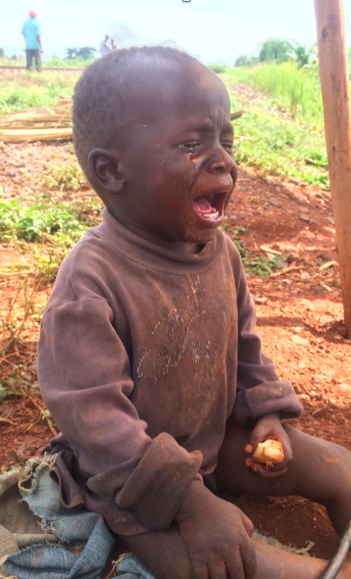 While this child's father was working he was left all day with a chunk of sugar cane to much on.