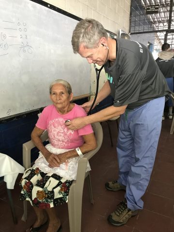 Dr. Gary Lipinski examines a patient.