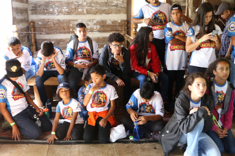 Pathfinders in David Hewitt Log Cabin Exhibit.
