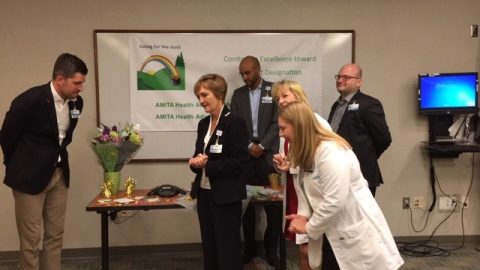 Hinsdale and La Grange CEO Mike Murrill and Chief Nursing Officer Mary Murphy and staff listen to a phone call announcing the Magnet news. The award had to be announced by phone among a small group due to the start of the COVID-19 pandemic.