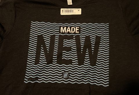 "Made New" read the shirt Herminio wore for his baptism at the Peoria Church.