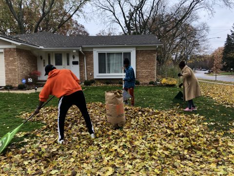 Karen Yang, family ministry director of the Ann Arbor Church, visited community houses with a group of refugee youth to rake leaves in exchange for donations.