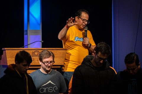Featured speaker, Jose Cortes Jr., associate ministerial director of the North American Division, prayed over attendees who answered an appeal.
