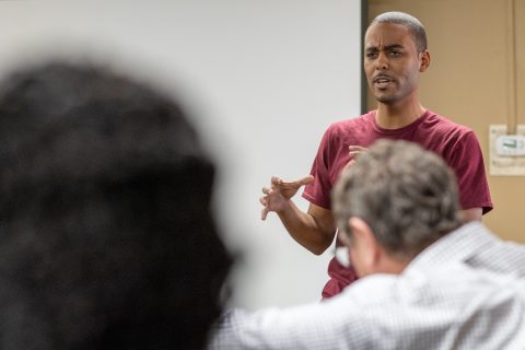 Illinois young adult Gerald Bedney leads in group discussion