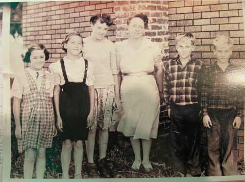 Photo taken 1944 outside the Aledo church school in Northern Illinois. Ramona Trubey (second from left) is pictured with, from left to right, Rebecca Greer, Elizabeth Greer, teacher  Lydia Marsh, Robert Fillingham and Larry Fillingham.
