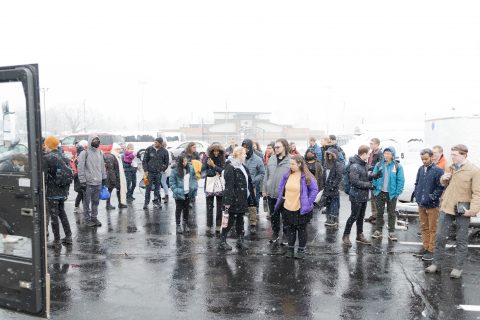 A group of attendees waits to get on the bus. Photo Credit: Josue Peralta